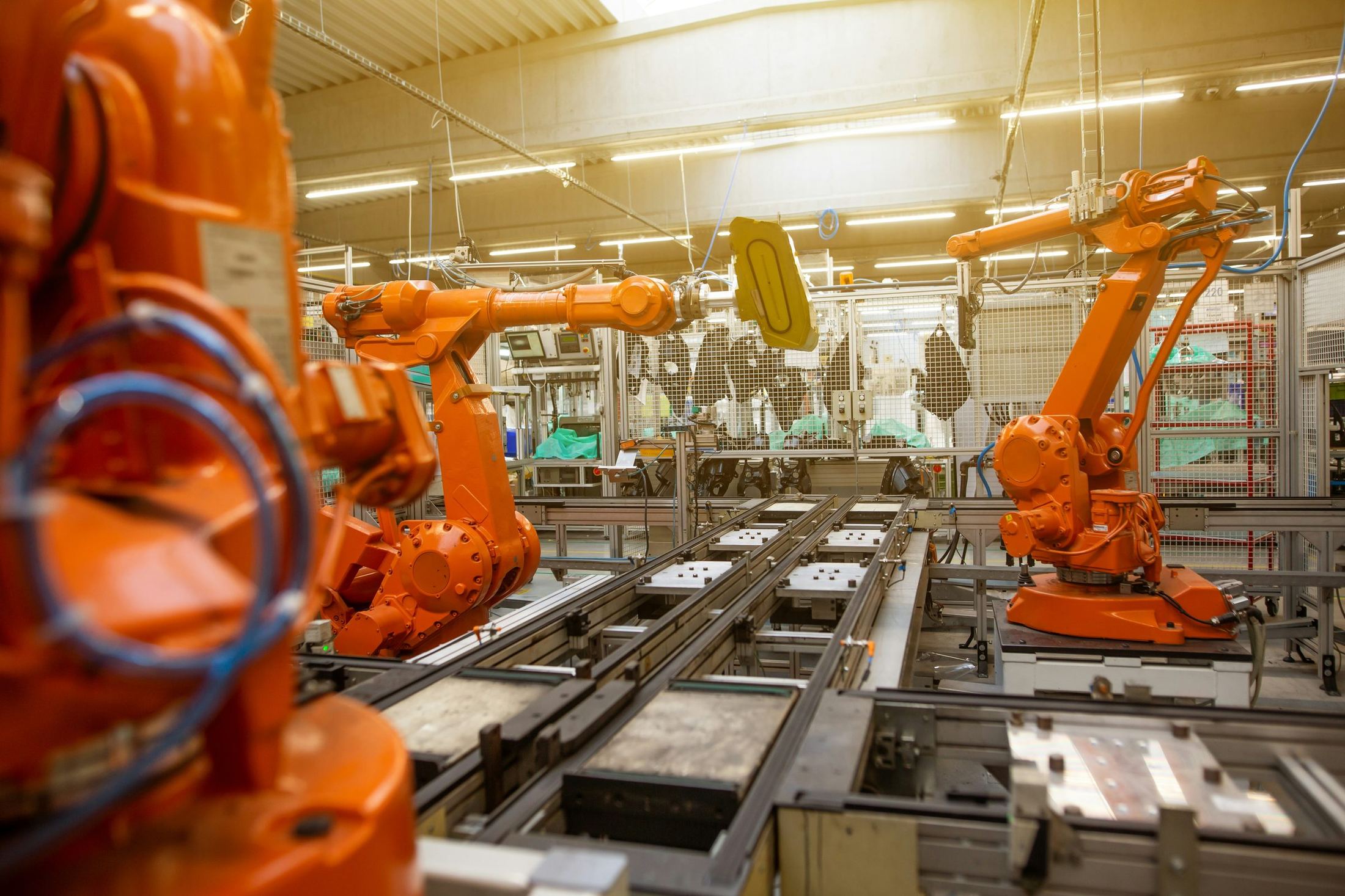 Automated robotic arms on a fabrication line